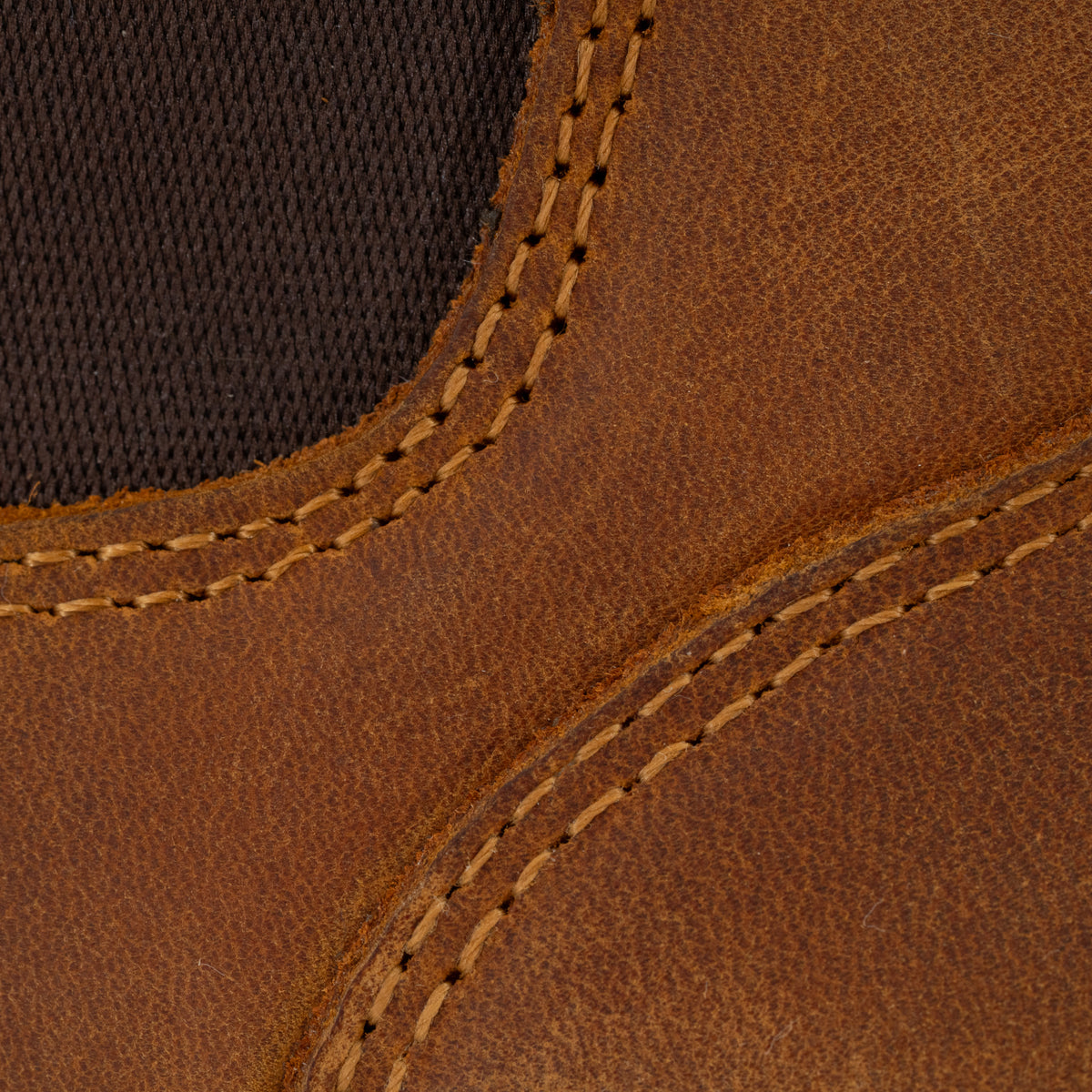 Close-up of Dive Bomb Tobacco Brown Heritage Boot with visible stitching