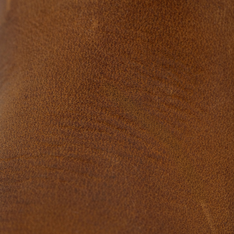 Close-up of Dive Bomb Tobacco Brown Heritage Boot of the full-grain cowhide texture.