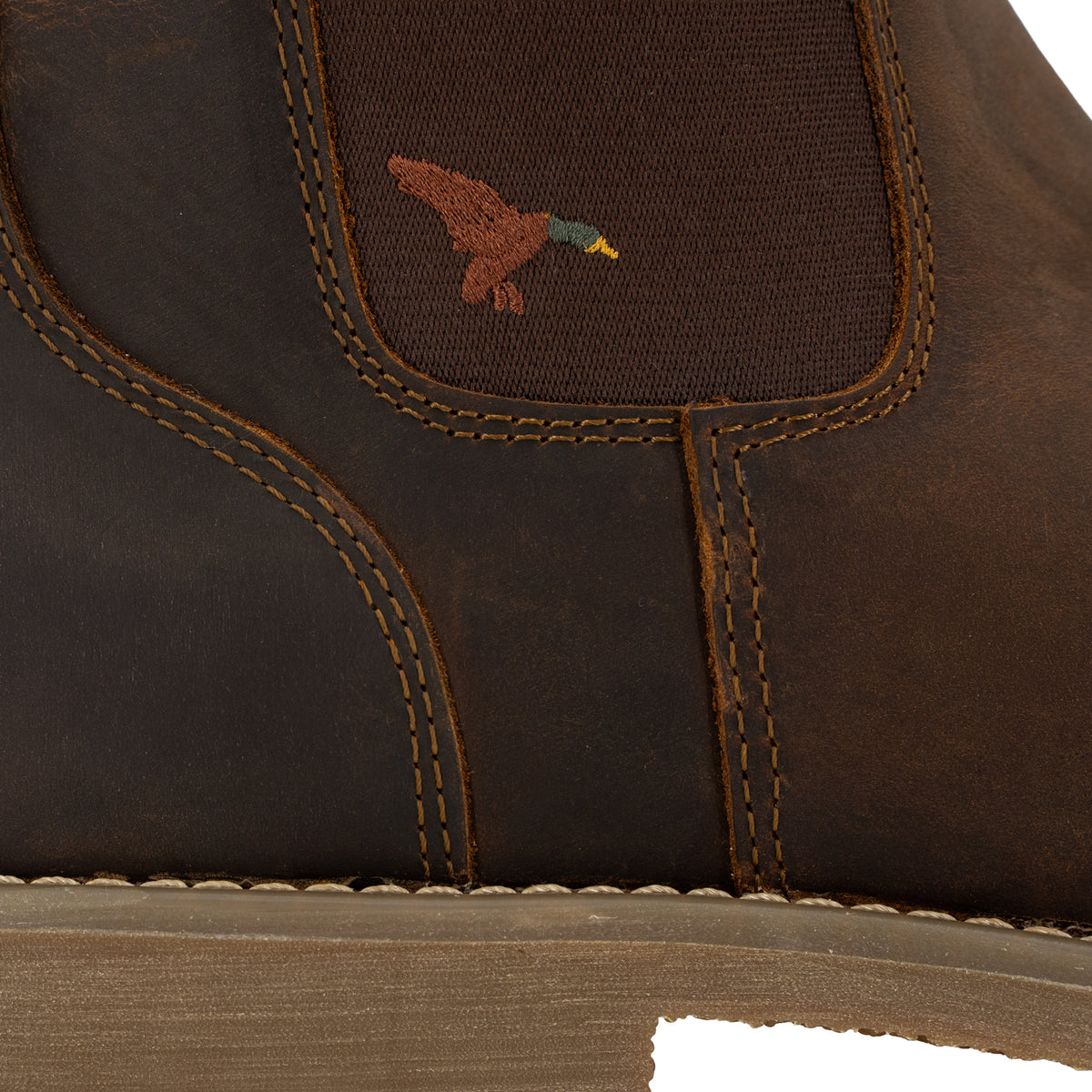 Close-up of Dive Bomb Dark Walnut Heritage Boot with an embroidered mallard.