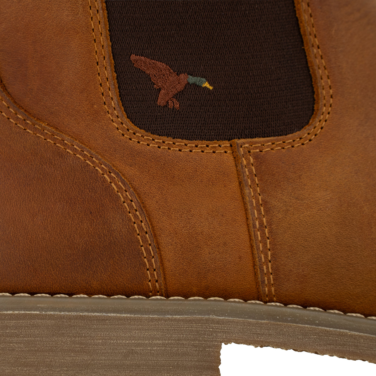 Close-up of Dive Bomb Tobacco Brown Heritage Boot with an embroidered mallard.