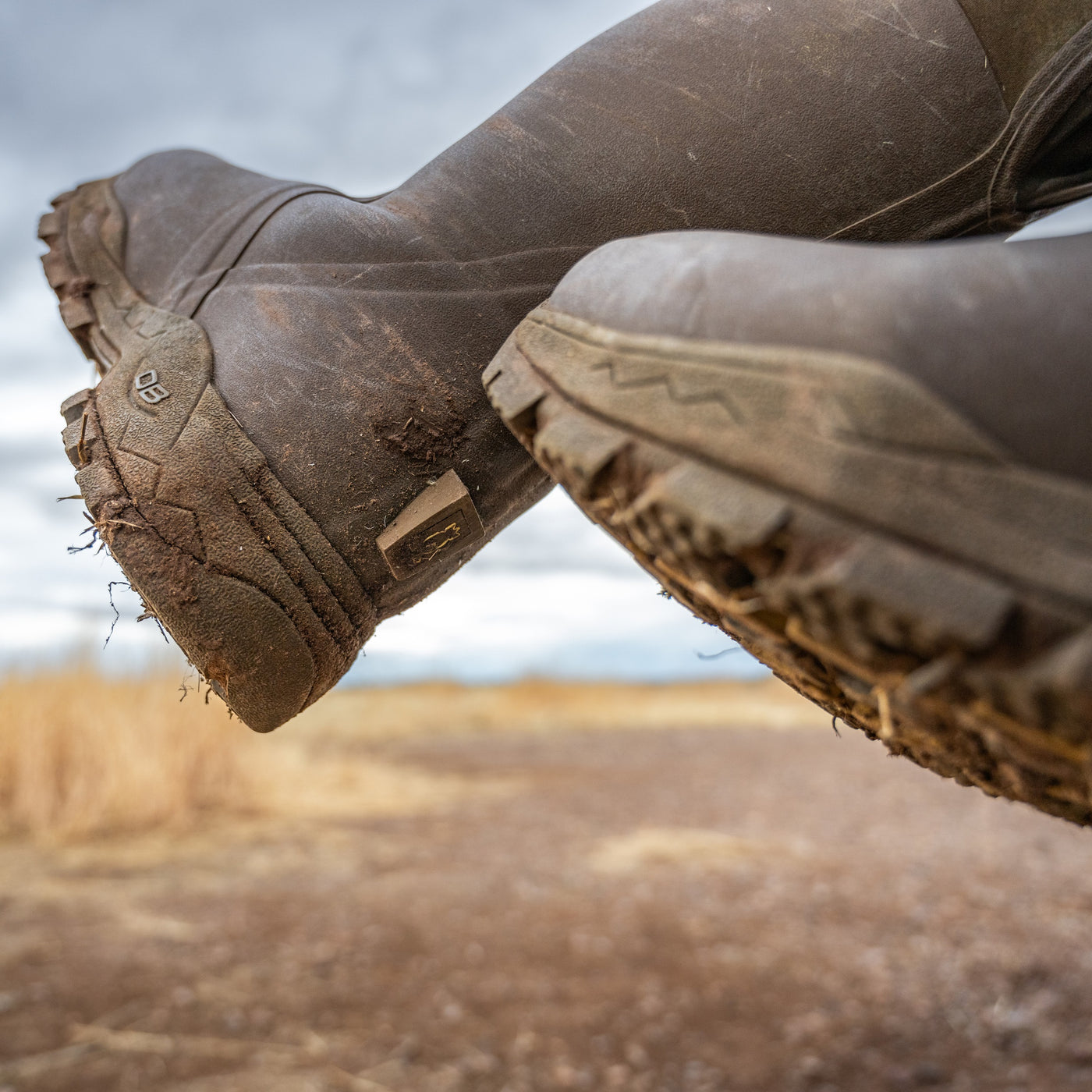 thigh high boots in mud